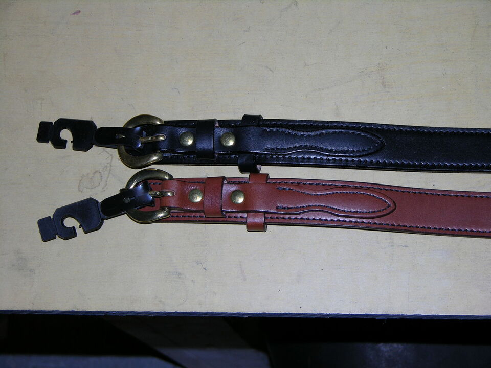 Top=black. Bottom is Brown, both with solid brass buckle.